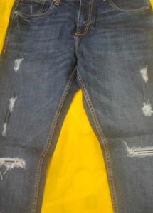 Distressed Blue Denim Jeans