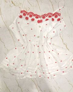 White top with red embroidery