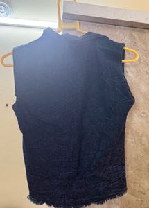 Denim vest with decorative buttons
