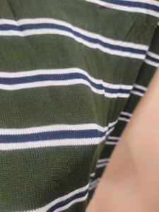 An olive green Sweater top