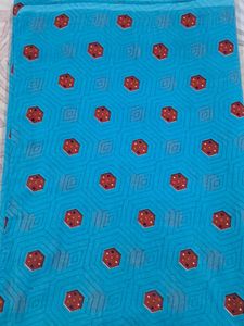 Blue Saree With Red And Some White Dots.