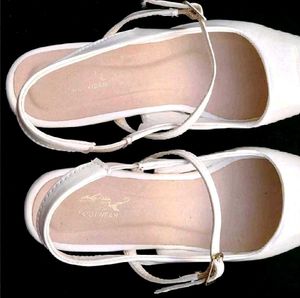 White Pointed Slingback Heels.