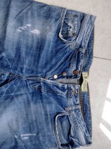 Distressed Blue Denim Jeans