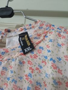 Flower themed peach top