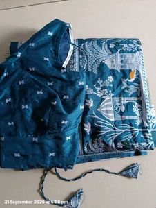 Elegant Teal Saree with Intricate Designs