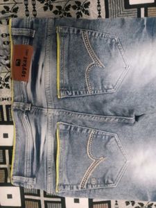 Stylish Blue Denim Jeans with Yellow Accent