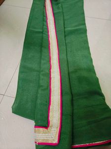 Elegant Green partywear Saree with Pink Border