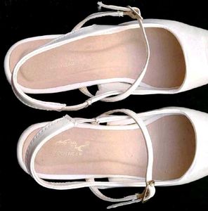 White Pointed Slingback Heels.