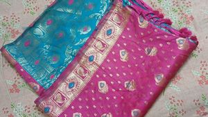 Elegant Teal Saree with Gold &amp; Pink Motifs