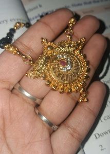 Mangalsutra. Exquisite Gold Necklace with Red Ston