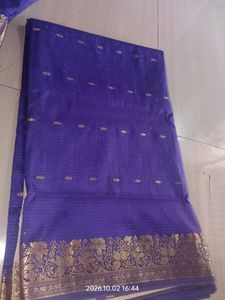 a purple saree with silver dotted design
