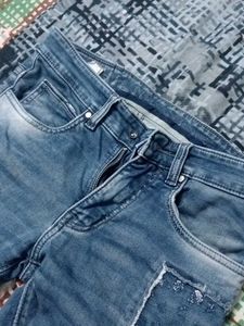 Distressed Blue Denim Jeans
