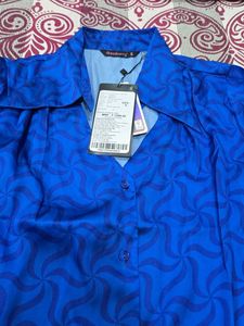 Vibrant Blue Button-Up Blouse with Geometric Patte
