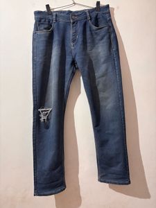 Distressed Blue Denim Jeans