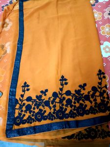 Vibrant Orange Saree with Floral Border