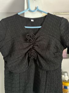Chic Textured Black Top with Rose Detail