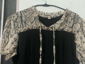 Elegant Black Dress with Printed Sleeves