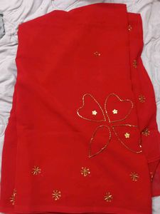 Vibrant Red Saree with Golden Embellishments