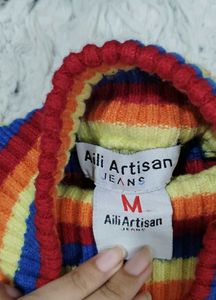 Rainbow Striped Cropped Turtleneck Sweater.