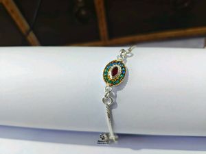 Elegant Pure Silver Oval Stone Rakhi