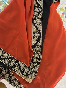 Elegant Orange Saree with Black Border