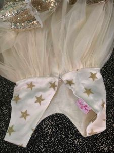 Sparkly Star Dress with Bow. colour is more bright