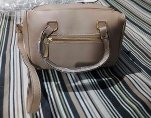 Chic Beige Handbag with Gold Accents