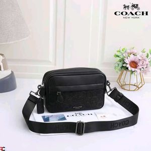COACH* *GRAHAM CROSSBODY IN SIGNATURE CANVAS