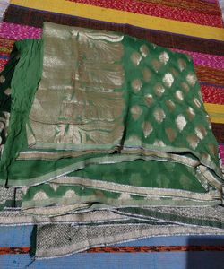 Elegant Green Saree with Gold Embellishments