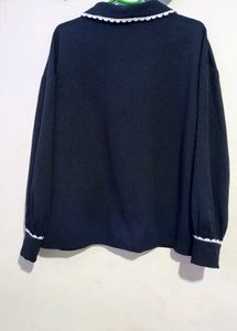Cute Black Cardigan with White Trim