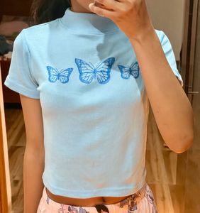 the pretty blue tops with butterfly