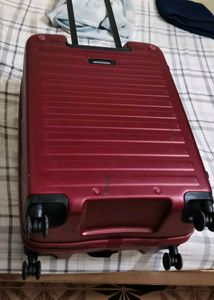 Maroon Hard Shell Luggage Handel grip is broken
