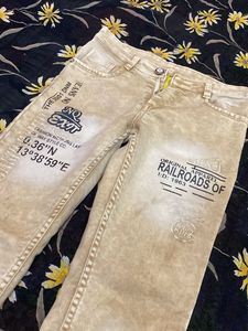 Stylish Beige Jeans with Graphic Print