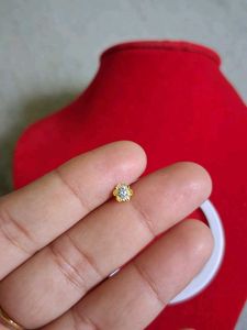 Gold Flower Nose Pin as earpressing