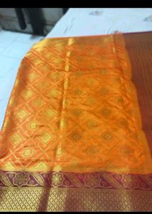 Orange Silk Saree with Gold Border