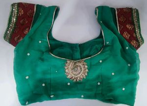 Elegant Teal Saree with Intricate Embellishments