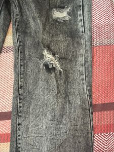 Acid washed distressed black oversized jeans