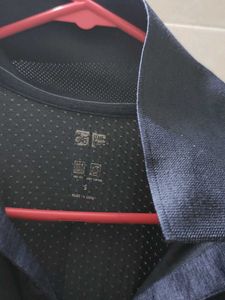 Uniqlo Men's Navy Blue Polo Shirt