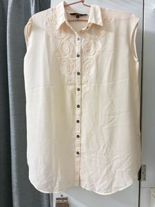 Elegant Cream Embroidered Sleeveless Blouse