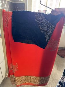 Vibrant Orange Embellished Saree with velvet blous