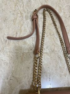 beige sling bag