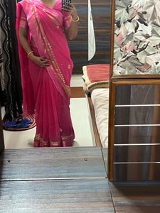 Elegant Pink Saree with Golden Detailing