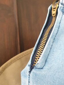 Light Wash Bell Bottom Jeans with Fringed Hem