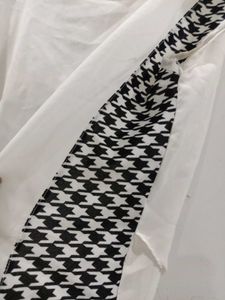 Elegant White Top with Patterned Sleeves
