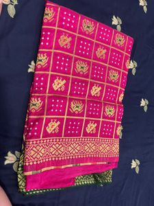 Vibrant Pink Saree with Gold Motifs