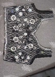 Selling a black color partywear stitched saree