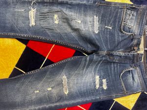 Distressed Blue Denim Jeans