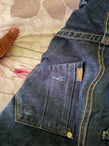 Distressed Blue Denim Jeans
