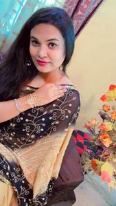 fancy black earrings and golden bracelet