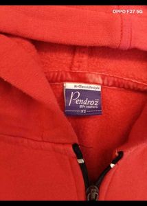 23. Red Zip-Up Hoodie with Paisley Design